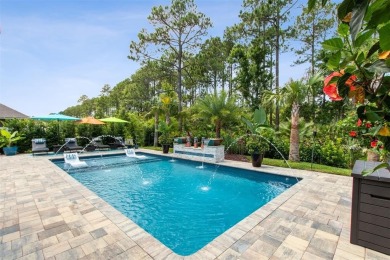 Experience luxury living in this stunning custom home in Amelia on Amelia National Golf and Country Club in Florida - for sale on GolfHomes.com, golf home, golf lot