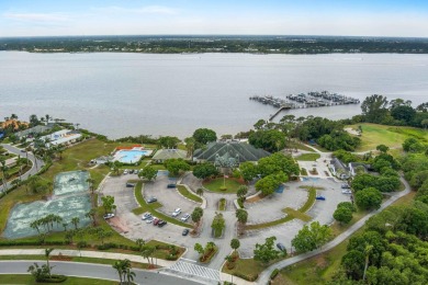 Soak in serene lake views with a backdrop of the golf course in on Santa Lucia River Club in Florida - for sale on GolfHomes.com, golf home, golf lot