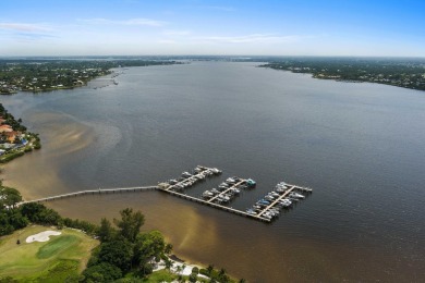 Soak in serene lake views with a backdrop of the golf course in on Santa Lucia River Club in Florida - for sale on GolfHomes.com, golf home, golf lot