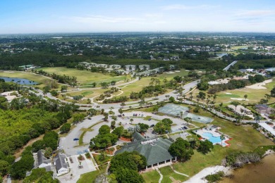 Soak in serene lake views with a backdrop of the golf course in on Santa Lucia River Club in Florida - for sale on GolfHomes.com, golf home, golf lot