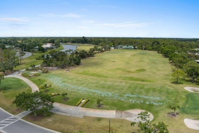 Soak in serene lake views with a backdrop of the golf course in on Santa Lucia River Club in Florida - for sale on GolfHomes.com, golf home, golf lot