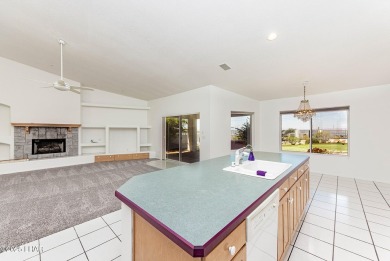 Step into comfort and style with this spacious 4-bedroom, 2 on London Bridge Golf Course in Arizona - for sale on GolfHomes.com, golf home, golf lot