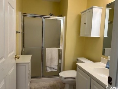 This corner unit golf course condo is tucked away in a serene on True Blue Plantation in South Carolina - for sale on GolfHomes.com, golf home, golf lot