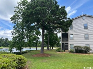 This corner unit golf course condo is tucked away in a serene on True Blue Plantation in South Carolina - for sale on GolfHomes.com, golf home, golf lot