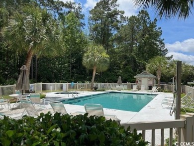 This corner unit golf course condo is tucked away in a serene on True Blue Plantation in South Carolina - for sale on GolfHomes.com, golf home, golf lot