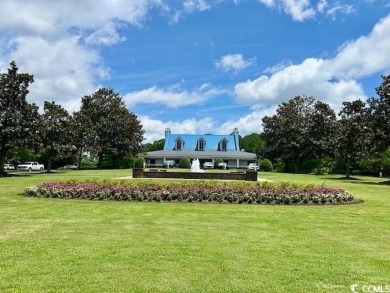 This corner unit golf course condo is tucked away in a serene on True Blue Plantation in South Carolina - for sale on GolfHomes.com, golf home, golf lot