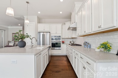 Experience elegant, low-maintenance living in the coveted on The Palisades Country Club in North Carolina - for sale on GolfHomes.com, golf home, golf lot