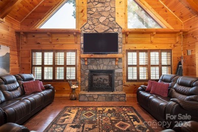 Discover this exceptional 1.5-story log home nestled in a on Lake Louise Golf Club in North Carolina - for sale on GolfHomes.com, golf home, golf lot