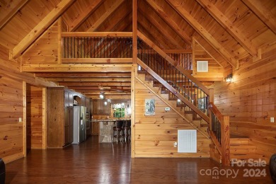 Discover this exceptional 1.5-story log home nestled in a on Lake Louise Golf Club in North Carolina - for sale on GolfHomes.com, golf home, golf lot