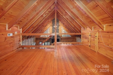 Discover this exceptional 1.5-story log home nestled in a on Lake Louise Golf Club in North Carolina - for sale on GolfHomes.com, golf home, golf lot