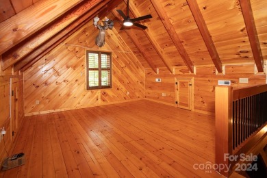 Discover this exceptional 1.5-story log home nestled in a on Lake Louise Golf Club in North Carolina - for sale on GolfHomes.com, golf home, golf lot