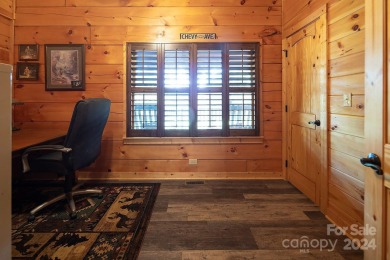 Discover this exceptional 1.5-story log home nestled in a on Lake Louise Golf Club in North Carolina - for sale on GolfHomes.com, golf home, golf lot