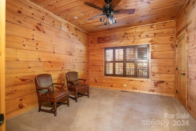 Discover this exceptional 1.5-story log home nestled in a on Lake Louise Golf Club in North Carolina - for sale on GolfHomes.com, golf home, golf lot