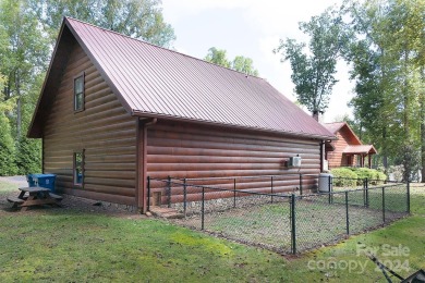 Discover this exceptional 1.5-story log home nestled in a on Lake Louise Golf Club in North Carolina - for sale on GolfHomes.com, golf home, golf lot