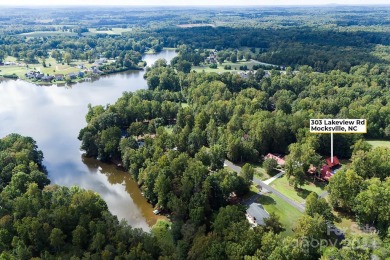 Discover this exceptional 1.5-story log home nestled in a on Lake Louise Golf Club in North Carolina - for sale on GolfHomes.com, golf home, golf lot