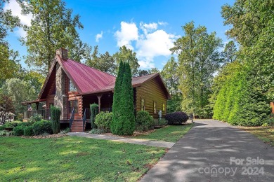 Discover this exceptional 1.5-story log home nestled in a on Lake Louise Golf Club in North Carolina - for sale on GolfHomes.com, golf home, golf lot