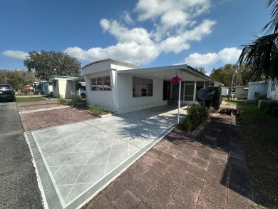 This has been the winter home for the sellers for over 20 years on Bay Tree Golf Course in Florida - for sale on GolfHomes.com, golf home, golf lot