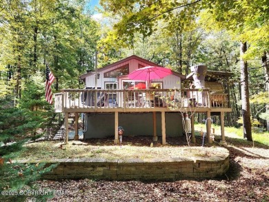 Experience the ultimate POCONO RETREAT!! This stunning raised on The Hideout Golf in Pennsylvania - for sale on GolfHomes.com, golf home, golf lot