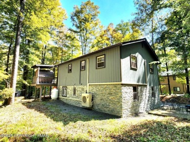 Experience the ultimate POCONO RETREAT!! This stunning raised on The Hideout Golf in Pennsylvania - for sale on GolfHomes.com, golf home, golf lot