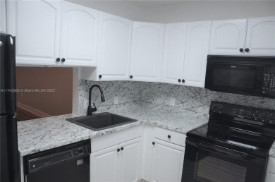 Experience serenity in this stunning 1-bedroom, 1-bathroom on Jacaranda Golf Club in Florida - for sale on GolfHomes.com, golf home, golf lot