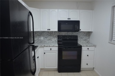 Experience serenity in this stunning 1-bedroom, 1-bathroom on Jacaranda Golf Club in Florida - for sale on GolfHomes.com, golf home, golf lot