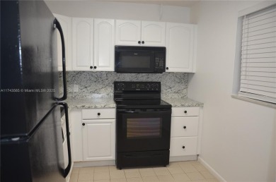 Experience serenity in this stunning 1-bedroom, 1-bathroom on Jacaranda Golf Club in Florida - for sale on GolfHomes.com, golf home, golf lot