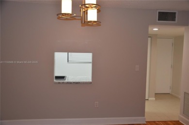 Experience serenity in this stunning 1-bedroom, 1-bathroom on Jacaranda Golf Club in Florida - for sale on GolfHomes.com, golf home, golf lot