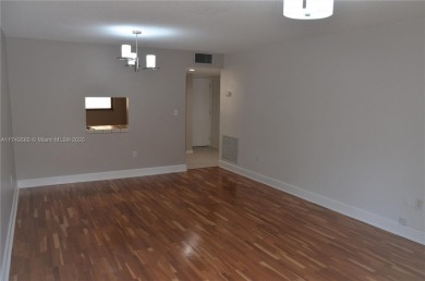 Experience serenity in this stunning 1-bedroom, 1-bathroom on Jacaranda Golf Club in Florida - for sale on GolfHomes.com, golf home, golf lot