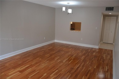 Experience serenity in this stunning 1-bedroom, 1-bathroom on Jacaranda Golf Club in Florida - for sale on GolfHomes.com, golf home, golf lot