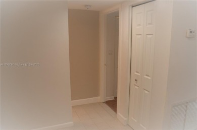 Experience serenity in this stunning 1-bedroom, 1-bathroom on Jacaranda Golf Club in Florida - for sale on GolfHomes.com, golf home, golf lot