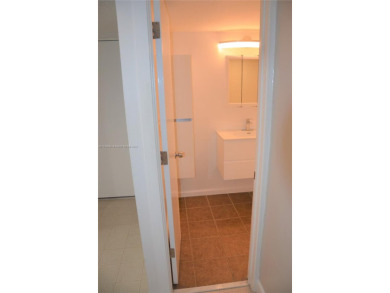 Experience serenity in this stunning 1-bedroom, 1-bathroom on Jacaranda Golf Club in Florida - for sale on GolfHomes.com, golf home, golf lot
