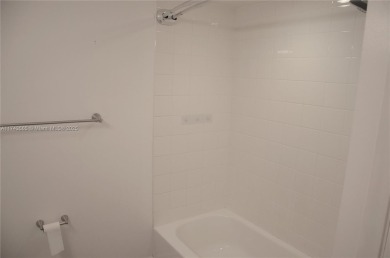 Experience serenity in this stunning 1-bedroom, 1-bathroom on Jacaranda Golf Club in Florida - for sale on GolfHomes.com, golf home, golf lot