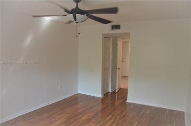 Experience serenity in this stunning 1-bedroom, 1-bathroom on Jacaranda Golf Club in Florida - for sale on GolfHomes.com, golf home, golf lot