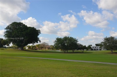 Experience serenity in this stunning 1-bedroom, 1-bathroom on Jacaranda Golf Club in Florida - for sale on GolfHomes.com, golf home, golf lot