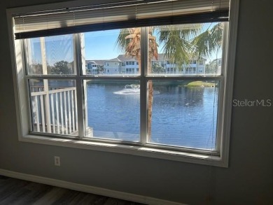 This ideal second floor condo has a sweeping view of the lake on Manatee County Golf Course in Florida - for sale on GolfHomes.com, golf home, golf lot