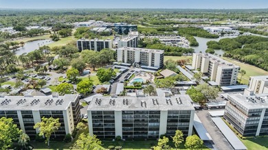 Welcome to this exclusive deluxe two bedroom, two bath corner on Cove Cay Country Club in Florida - for sale on GolfHomes.com, golf home, golf lot