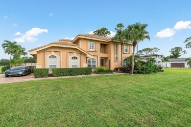 Spacious 5-bedroom, 4-bath, two-story home on a 1-acre lot in on PGA National Estates Golf Course in Florida - for sale on GolfHomes.com, golf home, golf lot