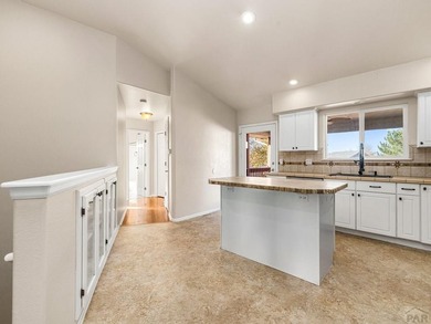 Experience the best of Colorado golf-course living in this on Desert Hawk At Pueblo West in Colorado - for sale on GolfHomes.com, golf home, golf lot