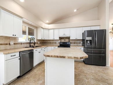 Experience the best of Colorado golf-course living in this on Desert Hawk At Pueblo West in Colorado - for sale on GolfHomes.com, golf home, golf lot