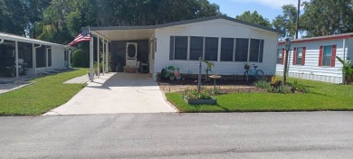 Come settle down and relax in a beautiful, manufactured home on Fairways Country Club in Florida - for sale on GolfHomes.com, golf home, golf lot