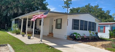 Come settle down and relax in a beautiful, manufactured home on Fairways Country Club in Florida - for sale on GolfHomes.com, golf home, golf lot