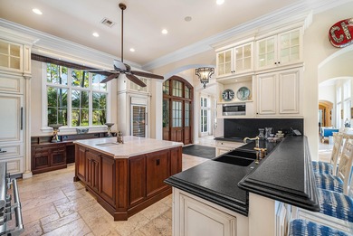 Experience Ultra-Luxury in This Sprawling Single Story Estate at on Old Marsh Golf Club in Florida - for sale on GolfHomes.com, golf home, golf lot