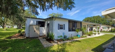 Come settle down and relax in a beautiful, manufactured home on Fairways Country Club in Florida - for sale on GolfHomes.com, golf home, golf lot