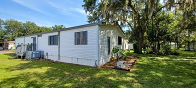 Come settle down and relax in a beautiful, manufactured home on Fairways Country Club in Florida - for sale on GolfHomes.com, golf home, golf lot