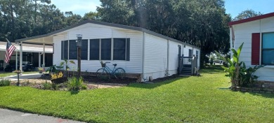 Come settle down and relax in a beautiful, manufactured home on Fairways Country Club in Florida - for sale on GolfHomes.com, golf home, golf lot