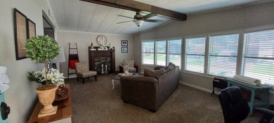 Come settle down and relax in a beautiful, manufactured home on Fairways Country Club in Florida - for sale on GolfHomes.com, golf home, golf lot