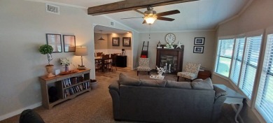 Come settle down and relax in a beautiful, manufactured home on Fairways Country Club in Florida - for sale on GolfHomes.com, golf home, golf lot