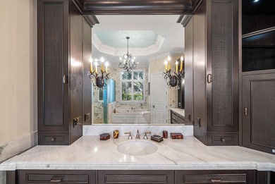 Experience Ultra-Luxury in This Sprawling Single Story Estate at on Old Marsh Golf Club in Florida - for sale on GolfHomes.com, golf home, golf lot