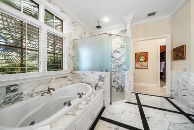 Experience Ultra-Luxury in This Sprawling Single Story Estate at on Old Marsh Golf Club in Florida - for sale on GolfHomes.com, golf home, golf lot