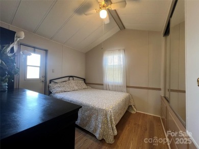 Welcome to Lake Life! This 1990 one bed/bath Park Model has been on Old North State Club at Uwharrie Point Golf community in North Carolina - for sale on GolfHomes.com, golf home, golf lot